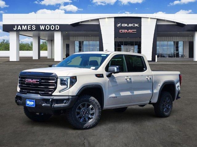 2026 GMC Sierra 1500 AT4X in Coastal Dune — front three-quarter view